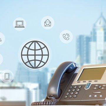 cost price voip service phonepower voip phone city in the background wireless cloud phone call computer icons symbols